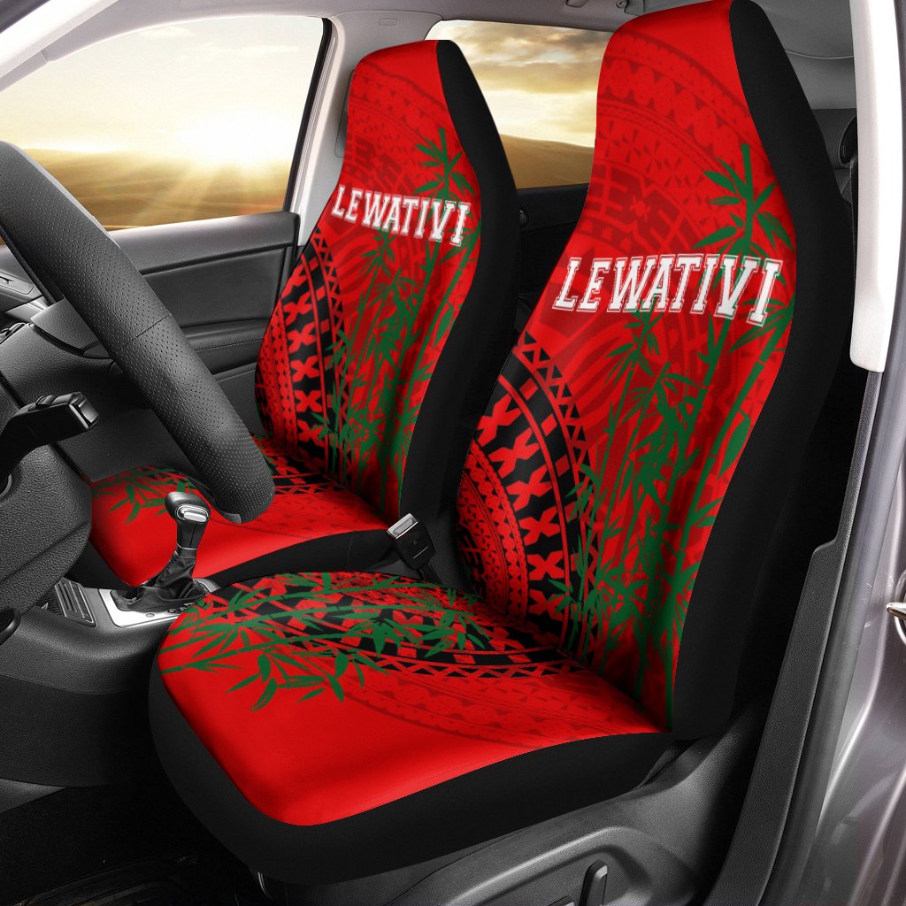 Red rugby seat covers with LEWATIVI logo and green leaf tribal pattern on front seats