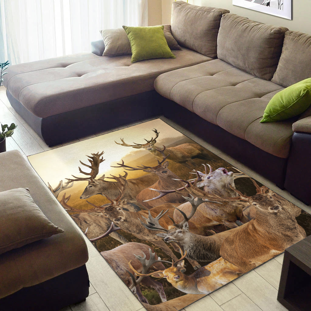 Rectangular area rug with deer and antlers collage in warm brown and tan
