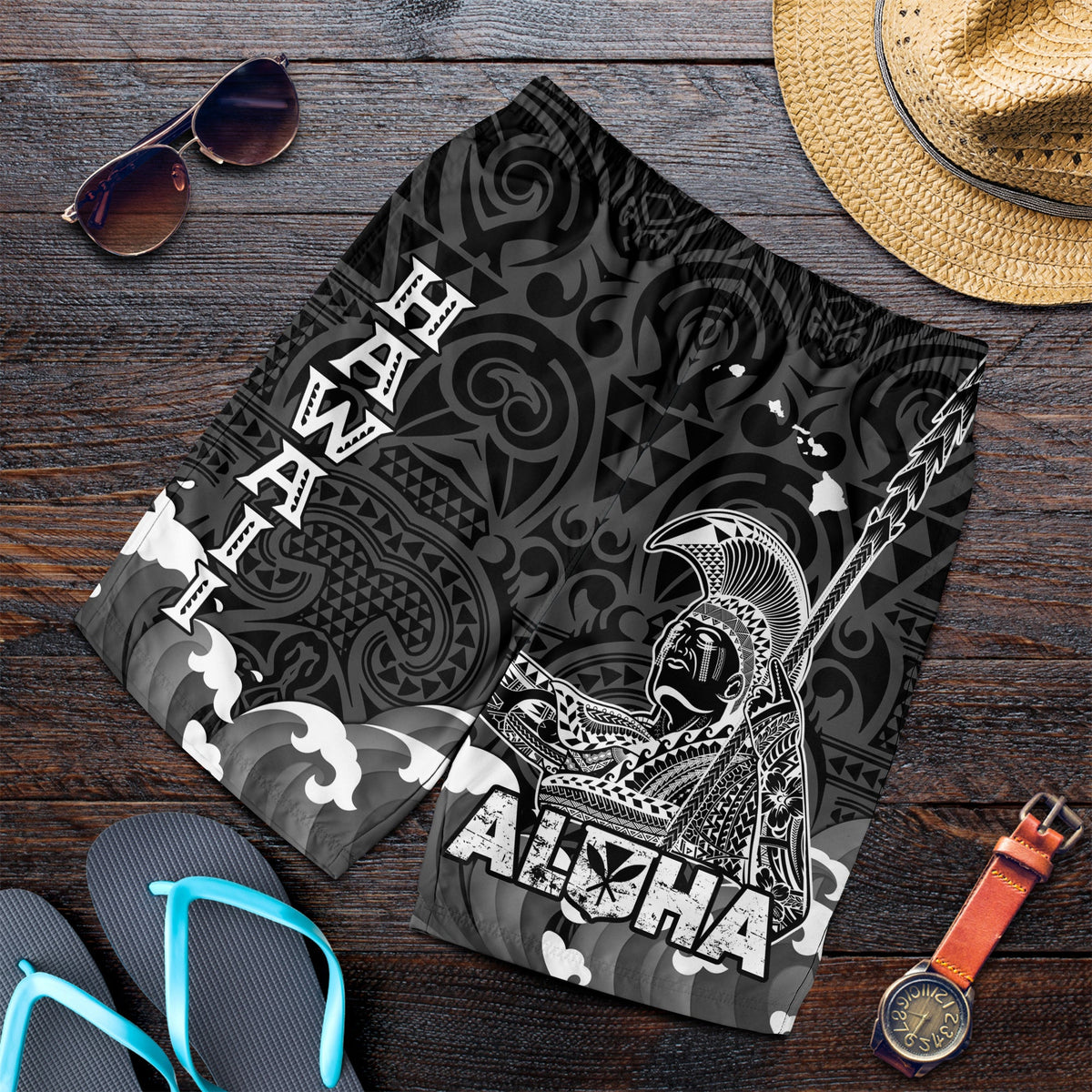 Men's black Hawaiian print swim shorts with tribal patterns, waves, and ALOHA design