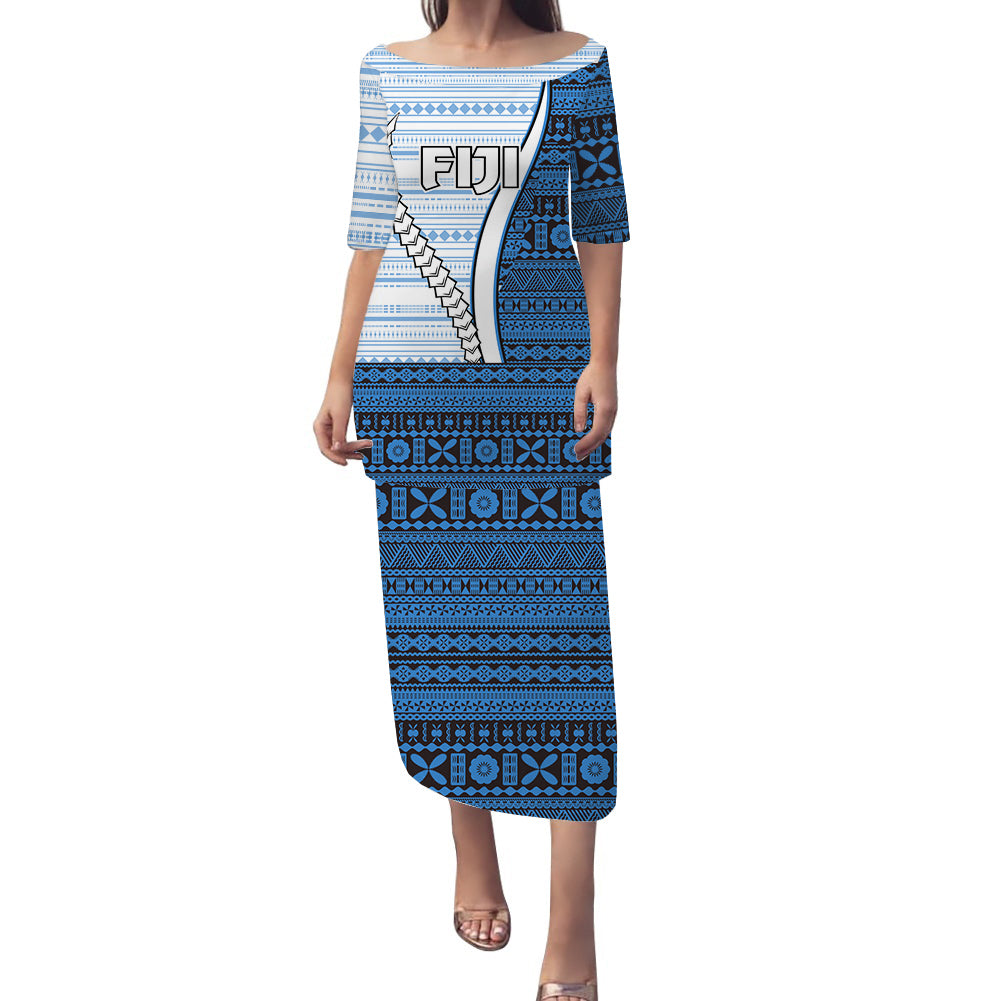 Long puletasi dress in blue with white tribal patterns, short sleeves, straight neckline