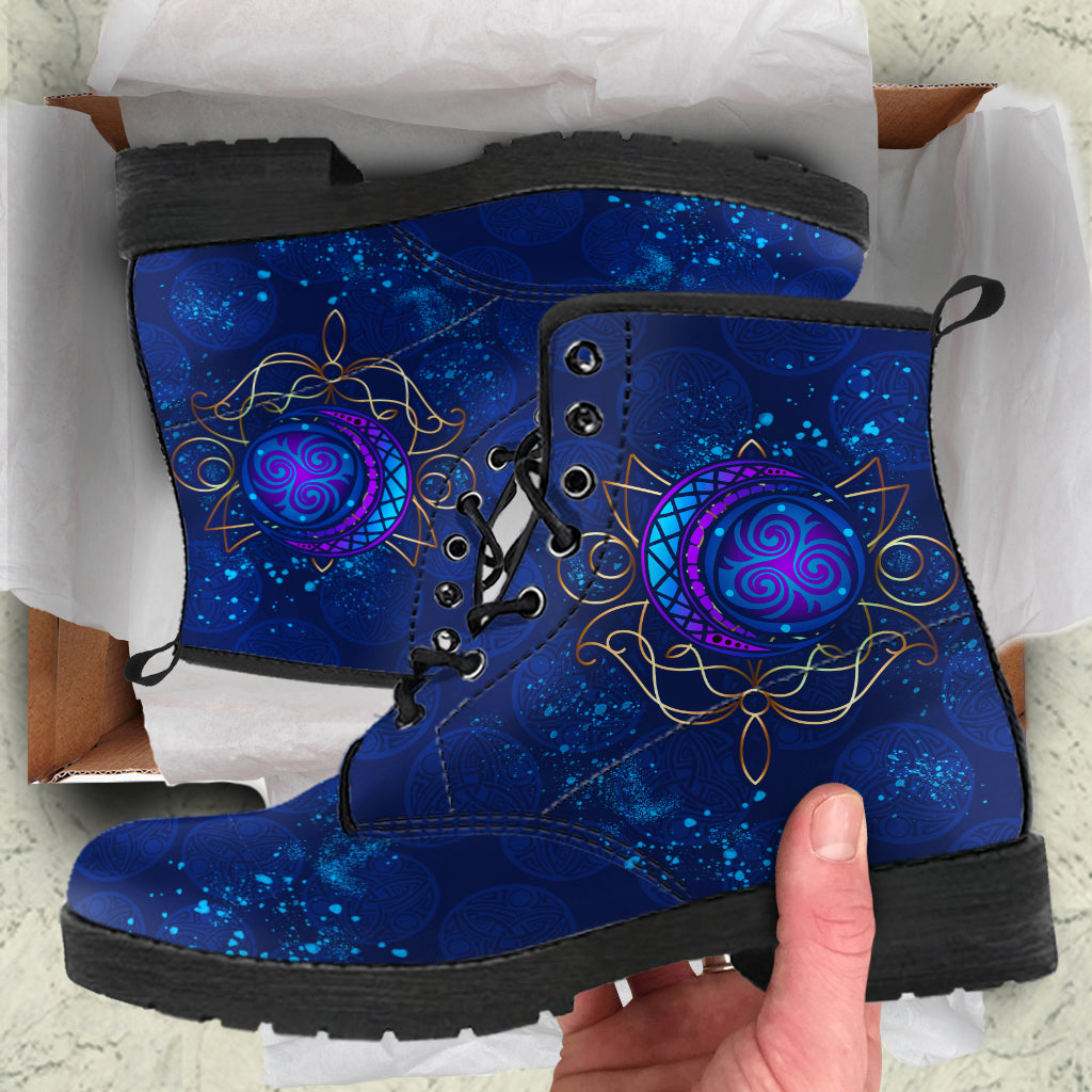 Blue lace-up leather boots with purple circular elven-style motif and black sole.