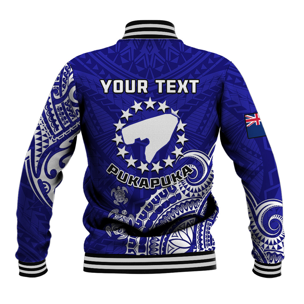Blue baseball jacket back with “YOUR TEXT” print, turtle emblem, ribbed striped hem
