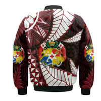 Black bomber jacket back with large central graphic and colorful sleeve emblems