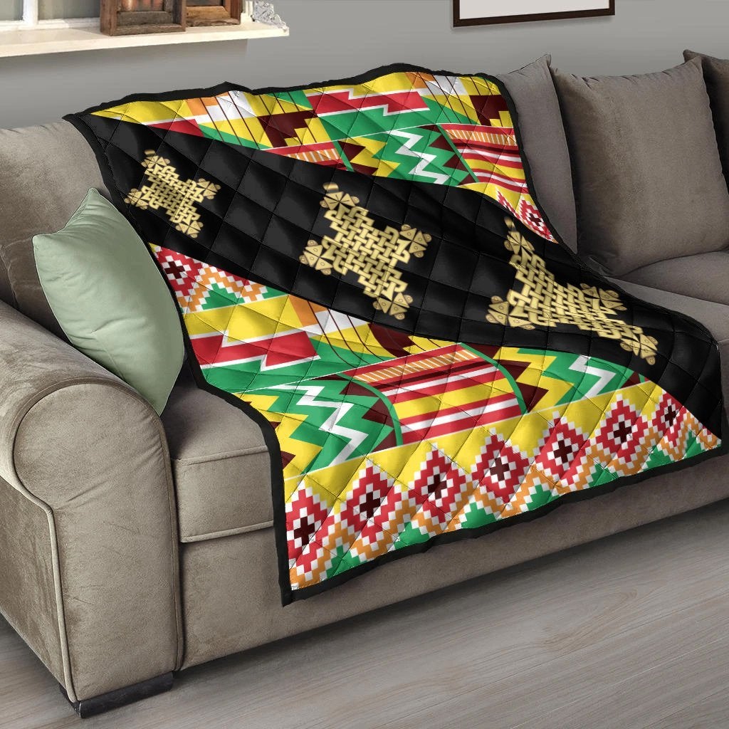 Multicolor Kente quilt with black backing and gold cross-like woven patterns