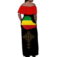 Black off-shoulder maxi dress back view, red yoke, Ethiopia map and motif print