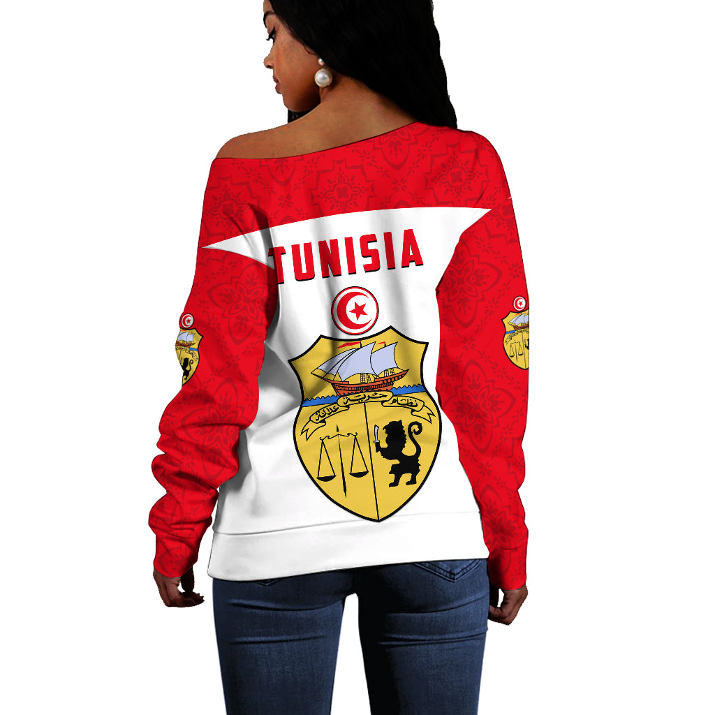 Back of white off-shoulder sweater with Tunisia crest, red sleeves and patterned shoulders