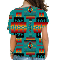 Back view: multicolor Native-style cross shoulder shirt on teal base