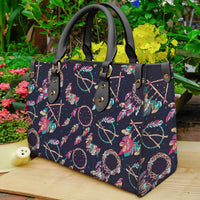 Dreamcatcher print tote bag with black leather handles, dark navy multicolor design