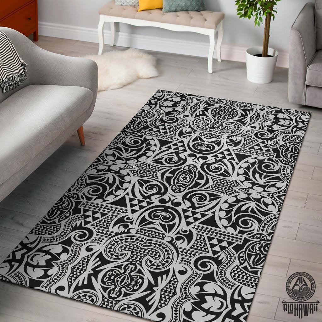 Black-and-white Polynesian area rug with bold swirling and tribal pattern, rectangular shape