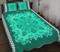 Teal-green quilt bed set, wide floral medallion pattern on bedspread