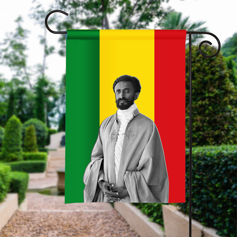 Garden flag with Haile Selassie portrait and green-yellow-red vertical stripes