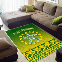 Green corner area rug with turtle graphic, yellow stars, tribal wave border