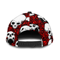 Back of skull and rose print cap in red, black, and white with black adjustable strap.