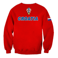 Red crewneck sweatshirt with CROATIA lettering, crest logo, and flag-style sleeve patch