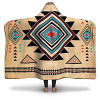 Tan hooded blanket with black and multicolor geometric southwest pattern, poncho style