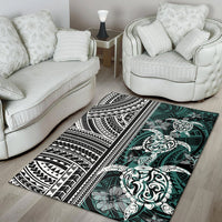 Black, white, and teal turtle area rug with tribal bands and large floral medallion