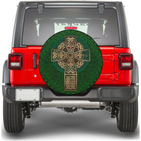 Round green spare tire cover featuring gold Celtic cross ornament