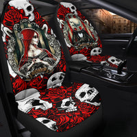 Car seat covers installed on front seats, red skull and rose pattern on black