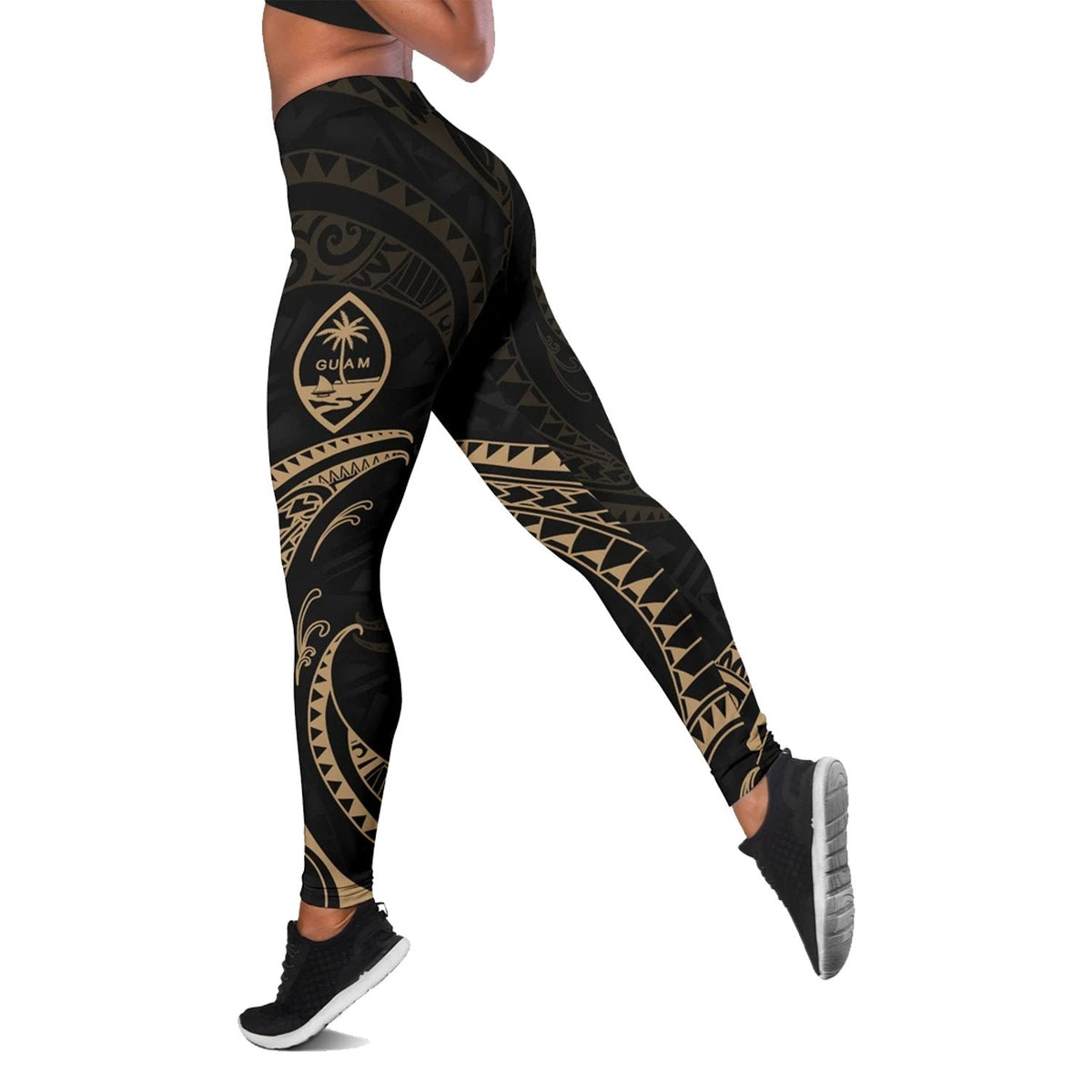 Black leggings with gold tribal wave print and hip shield emblem, full length