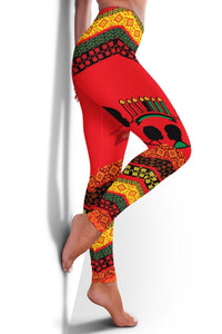 Red African print leggings showing drum, candles, and geometric border pattern