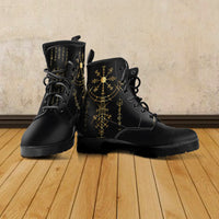 Pair of black lace-up sherpa boots with gold geometric rune artwork and chunky sole