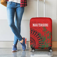Red suitcase cover with tapa design and NAITASIRI text, wheels and handle openings