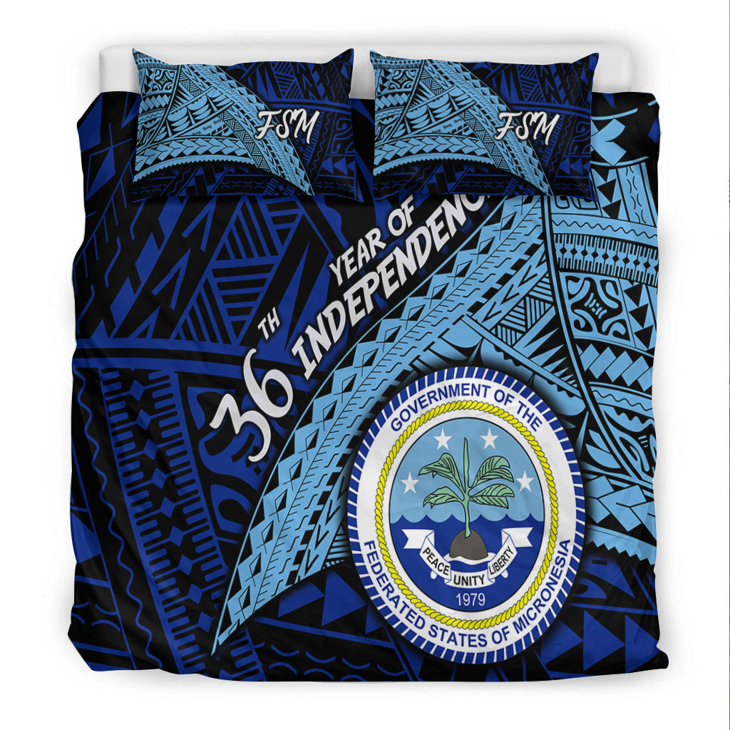 Blue FSM bedding set, full view with FSM pillows and circular Independence seal