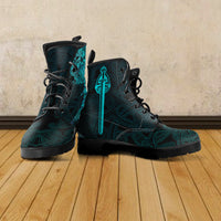 Pair of teal-and-black lace-up boots with embossed Viking-style raven emblem