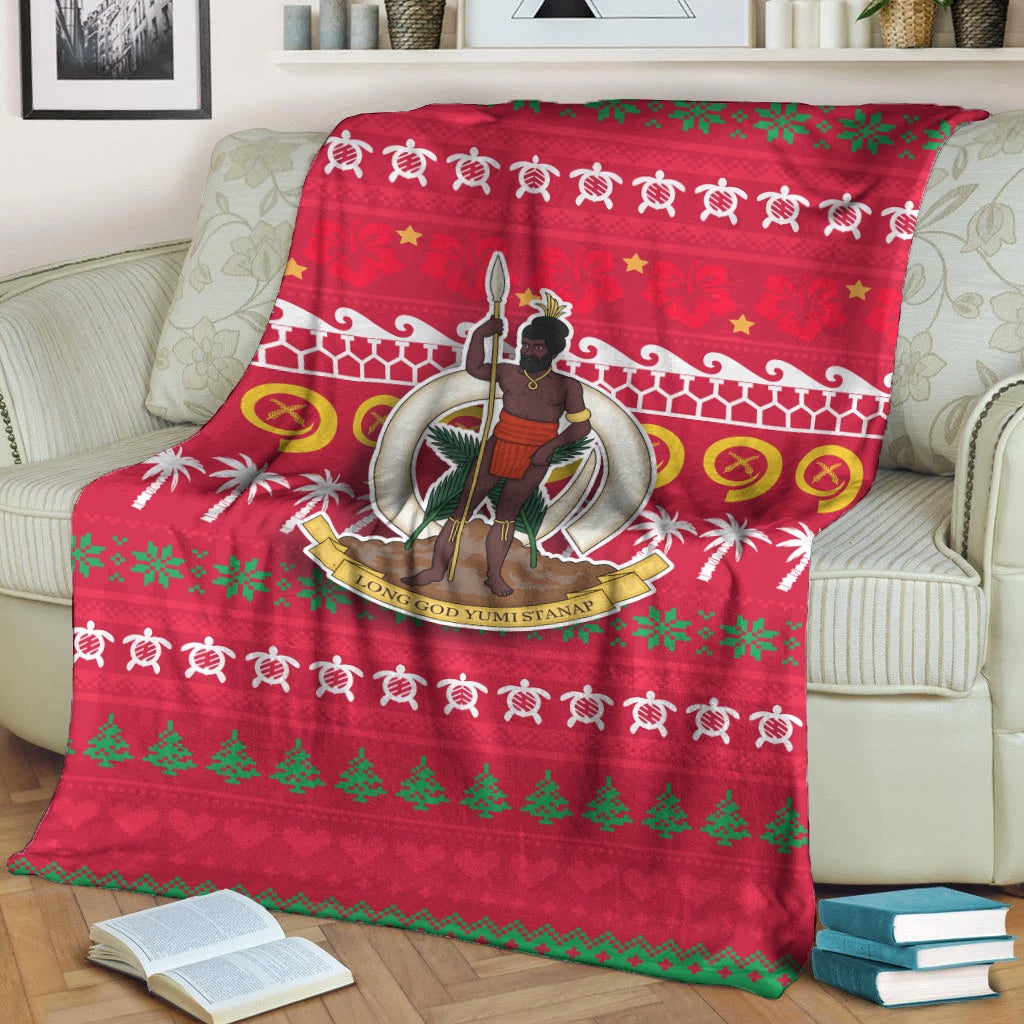 Red ugly Christmas blanket featuring central character with spear and decorative banner graphic