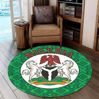 Round Nigeria carpet, bold NIGERIA lettering, green geometric border, horses with eagle