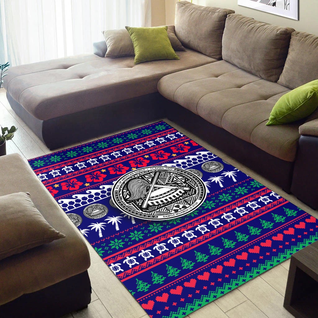 Blue area rug with central black-and-white emblem and red-green striped holiday bands