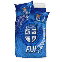 Blue Fiji duvet cover with two pillows, shield crest, coconut palm and tapa pattern