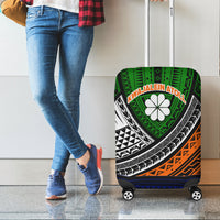 Green tribal suitcase luggage cover with white flower emblem and black orange graphics