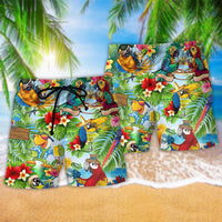 Parrot Hawaiian shorts with tropical birds, flowers, and drink graphic, front view