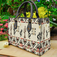 Multicolor print leather tote, cactus and dancer silhouettes, gold hardware, side view