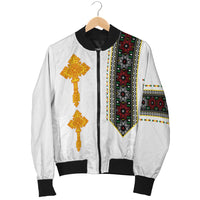 White bomber jacket on hanger, gold cross print and black ribbed cuffs