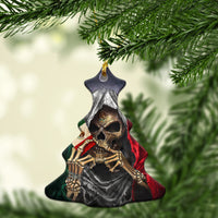 Star-shaped ceramic ornament with skull face and red green cloak, gold hanging loop