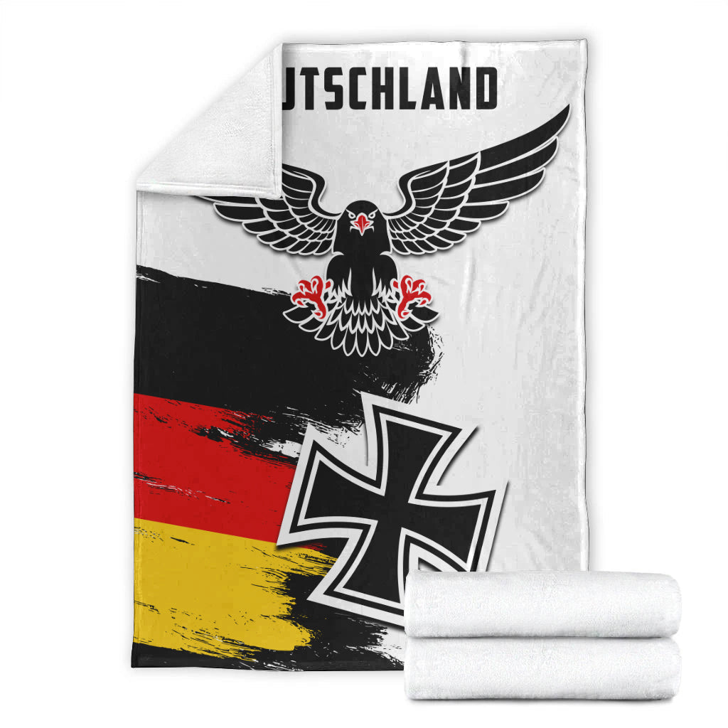 Folded German grunge blanket with eagle and iron-cross symbol in black, red, yellow
