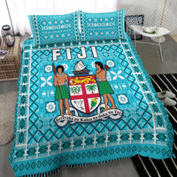 Turquoise Fiji tapa bedding set with central crest panel, two figures, and patterned edging
