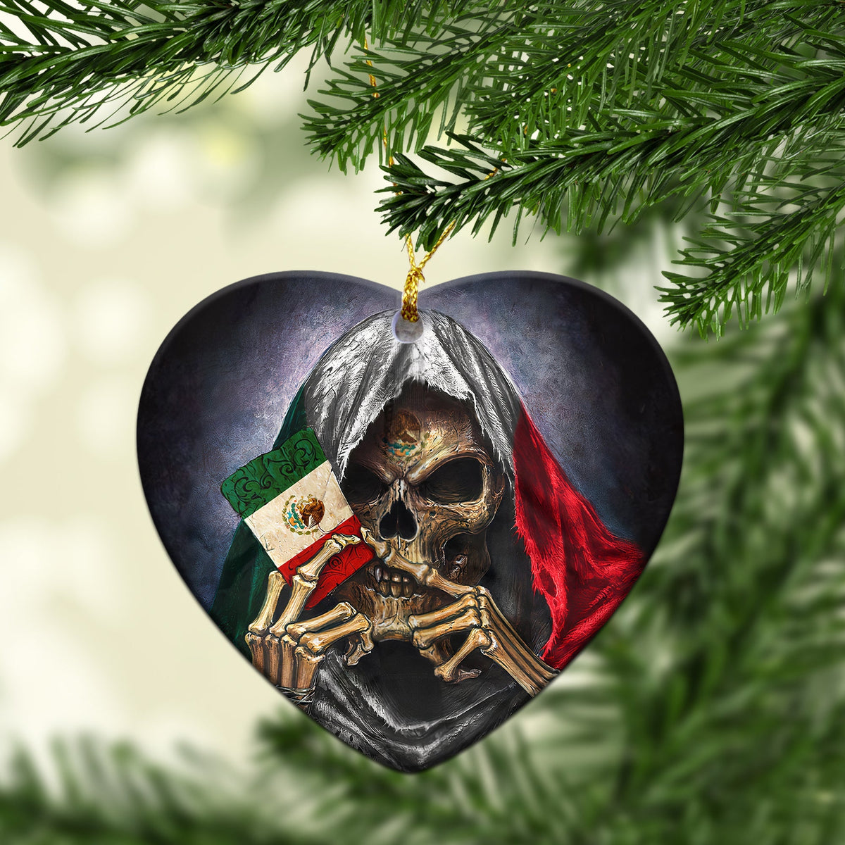 Heart-shaped ceramic ornament close-up with skull, red and green drape, gold hanging loop