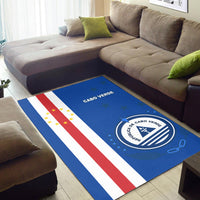 Blue area rug with red and white diagonal stripes and CABO VERDE crest