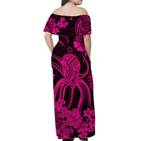 Back view off-shoulder maxi dress, black base with pink hibiscus and paisley print