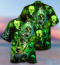 Green button-up Hawaiian shirt with multiple skulls, cannabis leaves, and swirling smoke