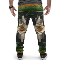 Front view jogger pants: black, green, and beige geometric pattern with star accents