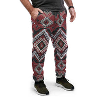 Native American-style jogger pants with red, black, and gray geometric pattern