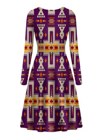 Purple long-sleeve skater dress with repeating geometric motifs and bright orange accents
