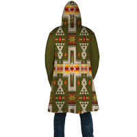 Back view cloak, dark green with large cross and geometric tribal pattern, hood up