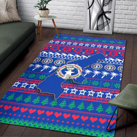 Blue map Christmas rug with wreath emblem, patterned borders, hearts and pine designs