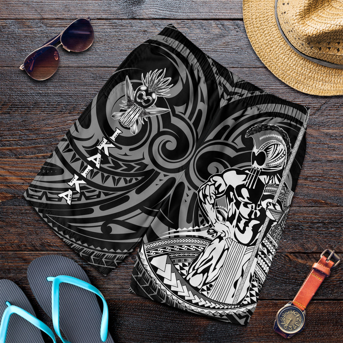 Black men’s swim shorts with gray tribal warrior graphic print and elastic waistband