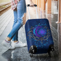 Blue luggage cover on a rolling suitcase, purple crescent spiral with gold trim